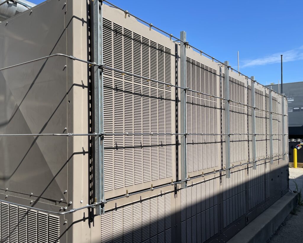 condenser coil cooling system installed in parallel lines across the intake of an air conditioning system.